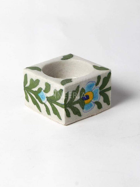 Turquoise Flower With Green Leaves on White Base